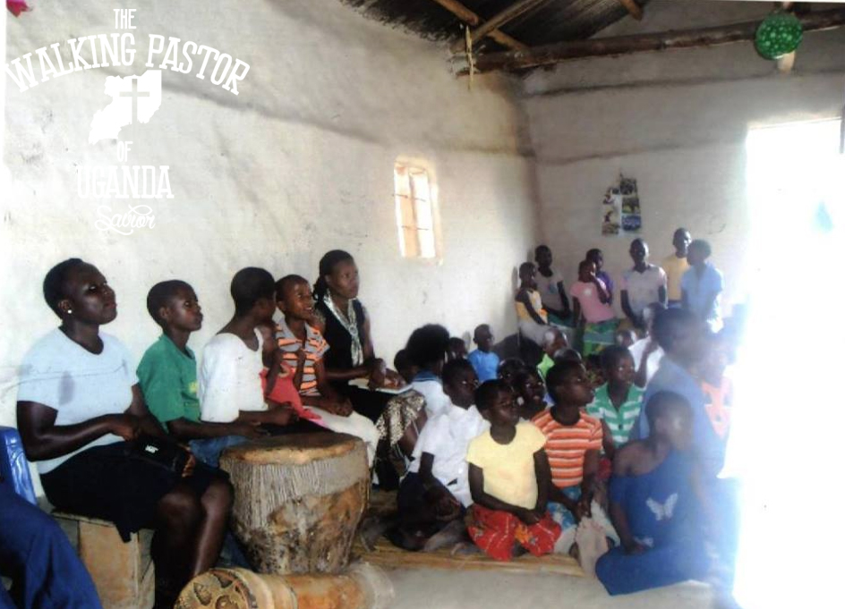 Kusasira preaching the Word of God at a Ugandan village