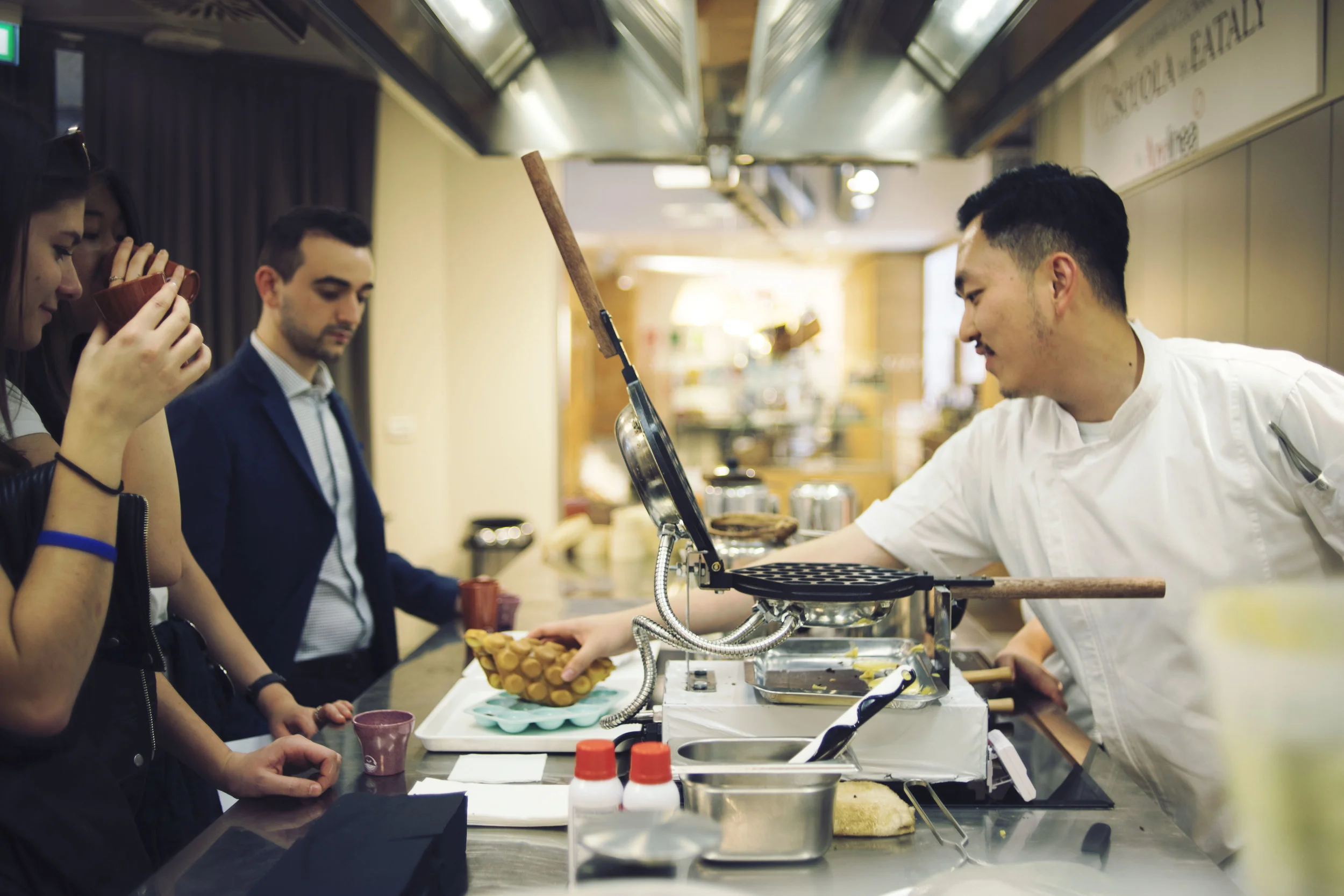 Caleb Ng is serving the Hong Kong signature eggette to the Italian crowd in Eataly, the biggest Italian supermarket in Italy. 