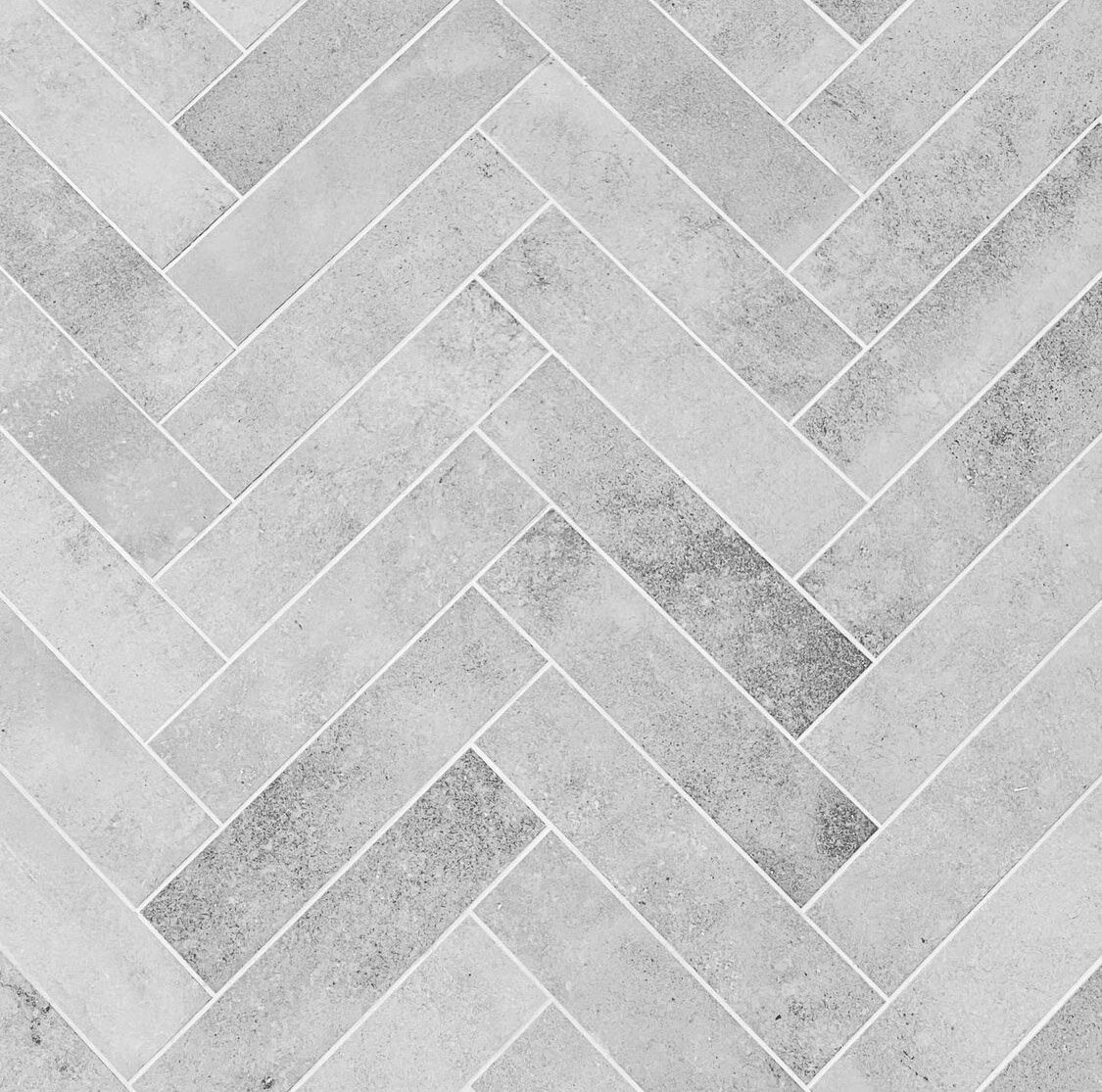 White grout emphasises herringbone pattern