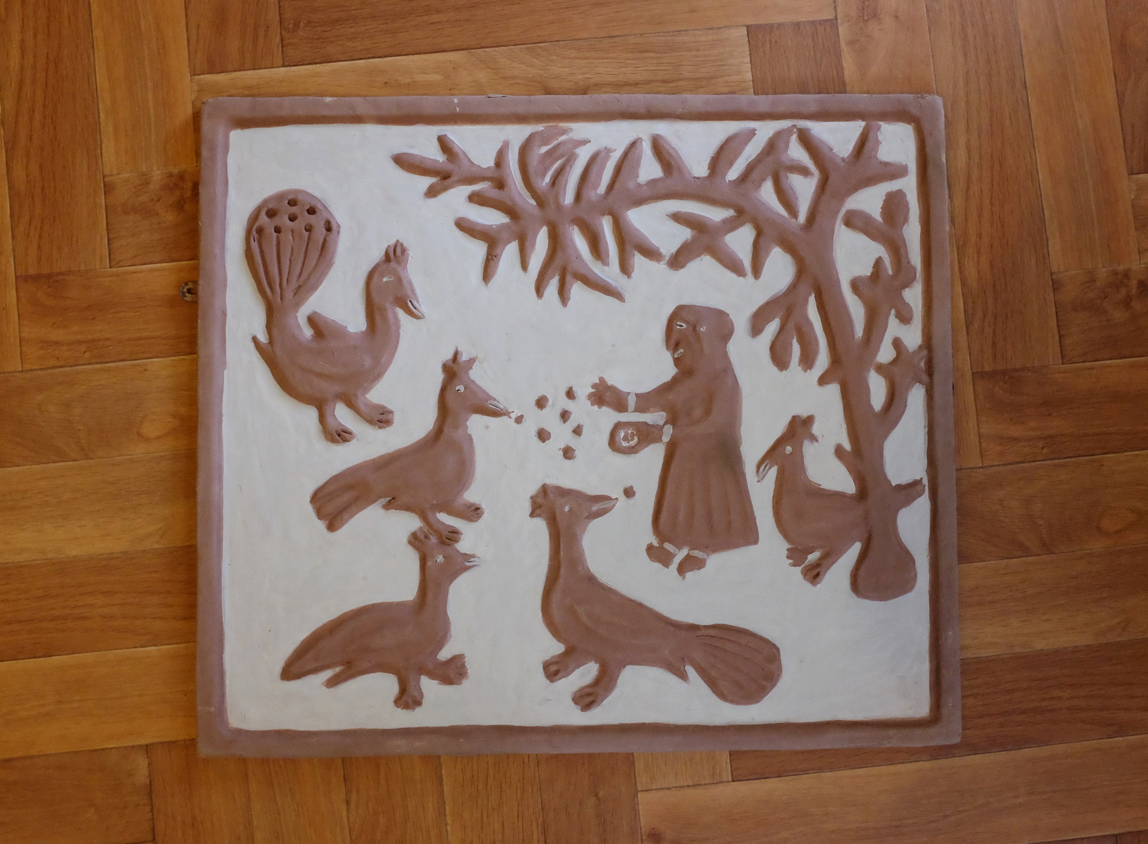 Photograph of a clay relief by Mrs Ranjit Dhanjal taken on an archive home visit. 