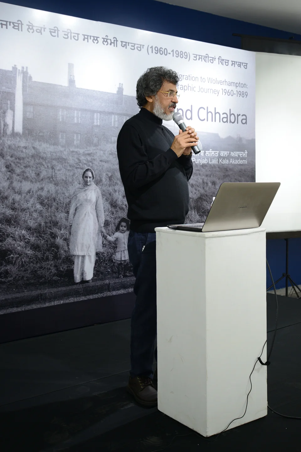 CHANDIGARH, PUNJAB - The truly great, amazing and very talented Diwan Manna an internationally recognised artist in his own right and President of the Punjab Lalit Kala Akademi- Diwan opens preceding for and behalf of a presentation on Punjabi Migration to Wolverhampton at the Akademi. Anand and he have become fantastic friends. Picture background courtesy of the DASS family Inkerman Street, Wolverhampton c1961.