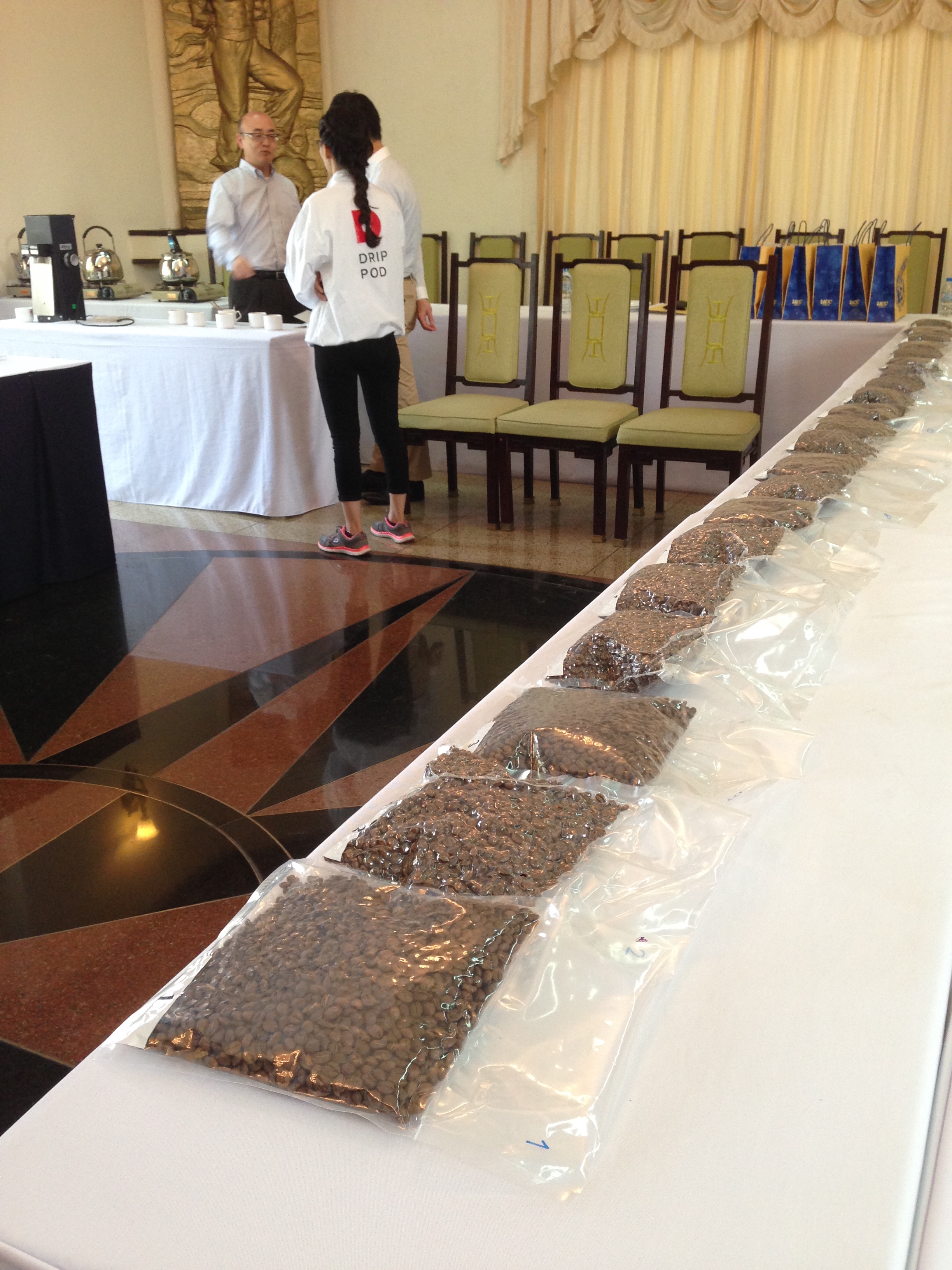 Samples await while UCC's Shunta Baba briefs the volunteer staff.