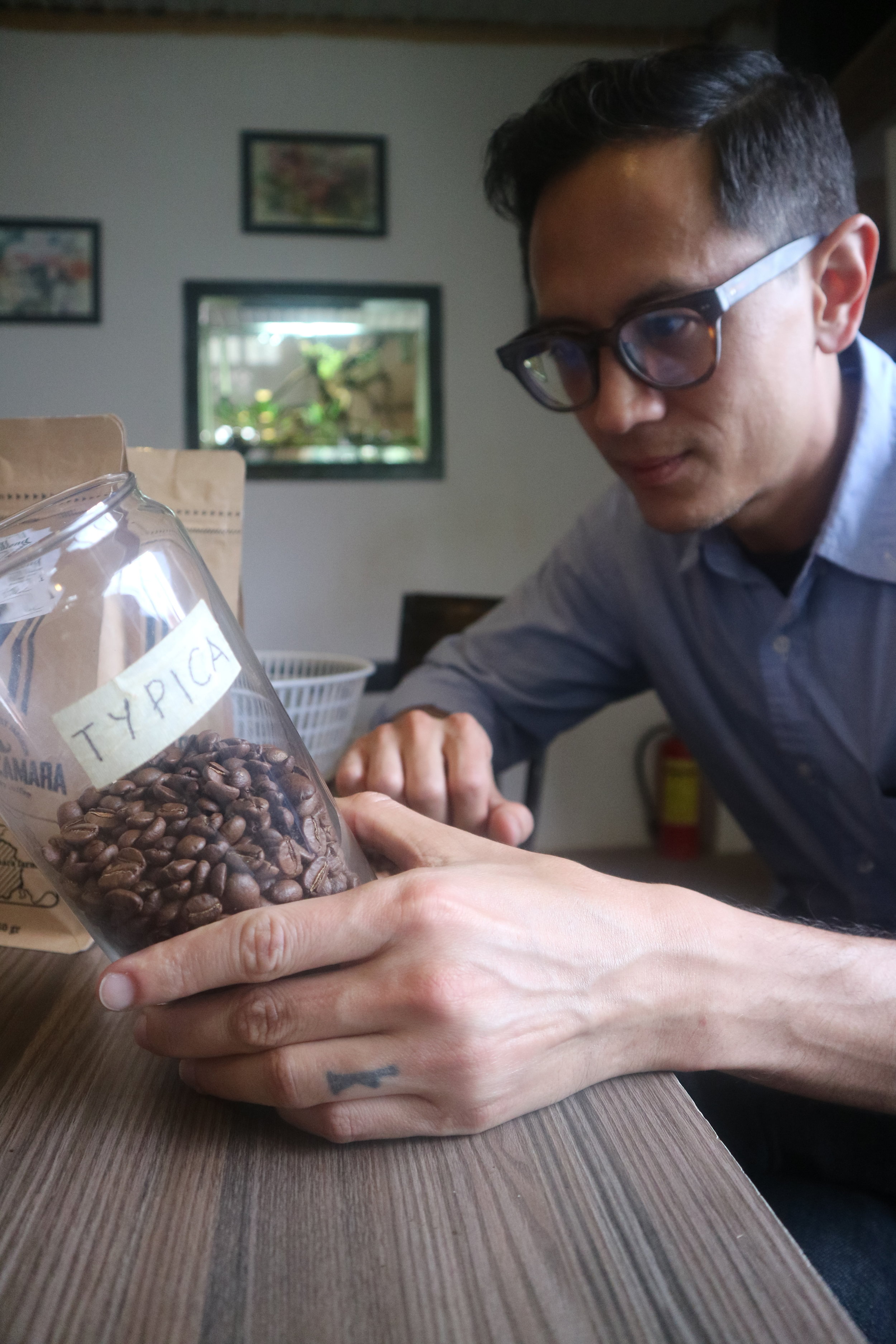 Typical - trying to stare down a container of coffee (the coffee always wins).
