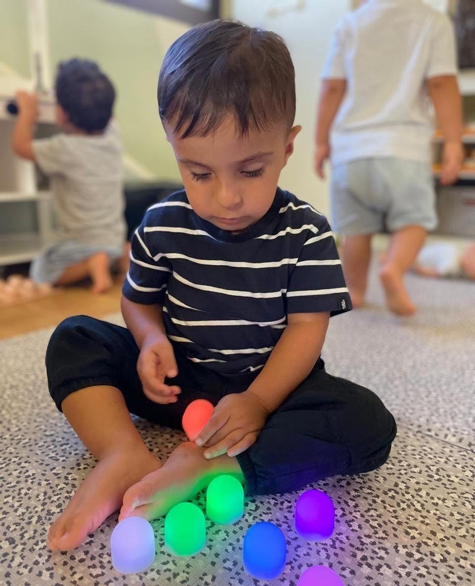 Learning through play! 🌈✨ Exploring color-changing lights with curiosity and joy. Sparking interest in children is so crucial, and its done best when we keep things simple and inviting, for them to focus and engage in.⁠
⁠
⁠
⁠
#inspirephilosophy#lear
