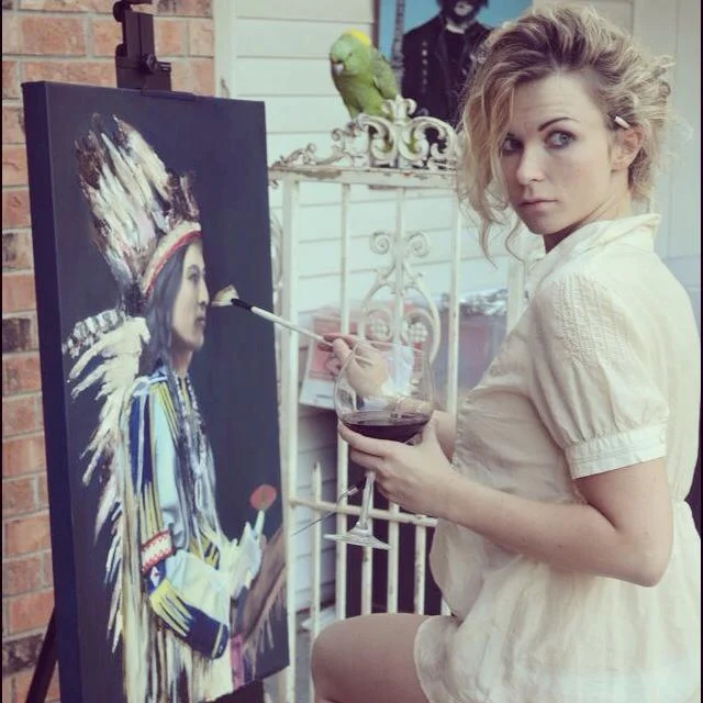 Photograph of me painting "Chief of the Chickasaw" Photo taken by Kristen Gurba
