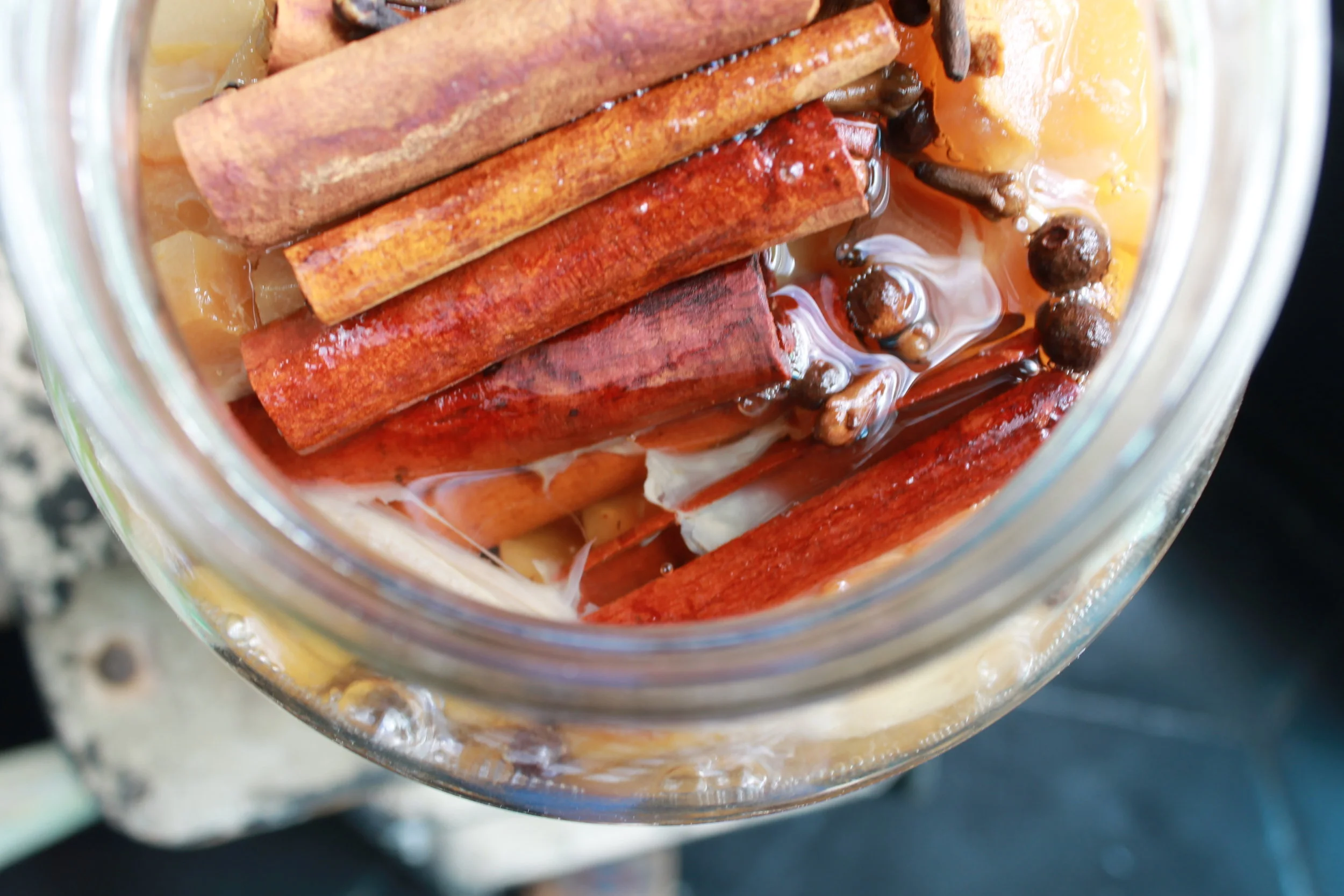 You can flavor your vinegars in a variety of ways! Here we're flavoring apple cider vinegar with cinnamon, clove and allspice.