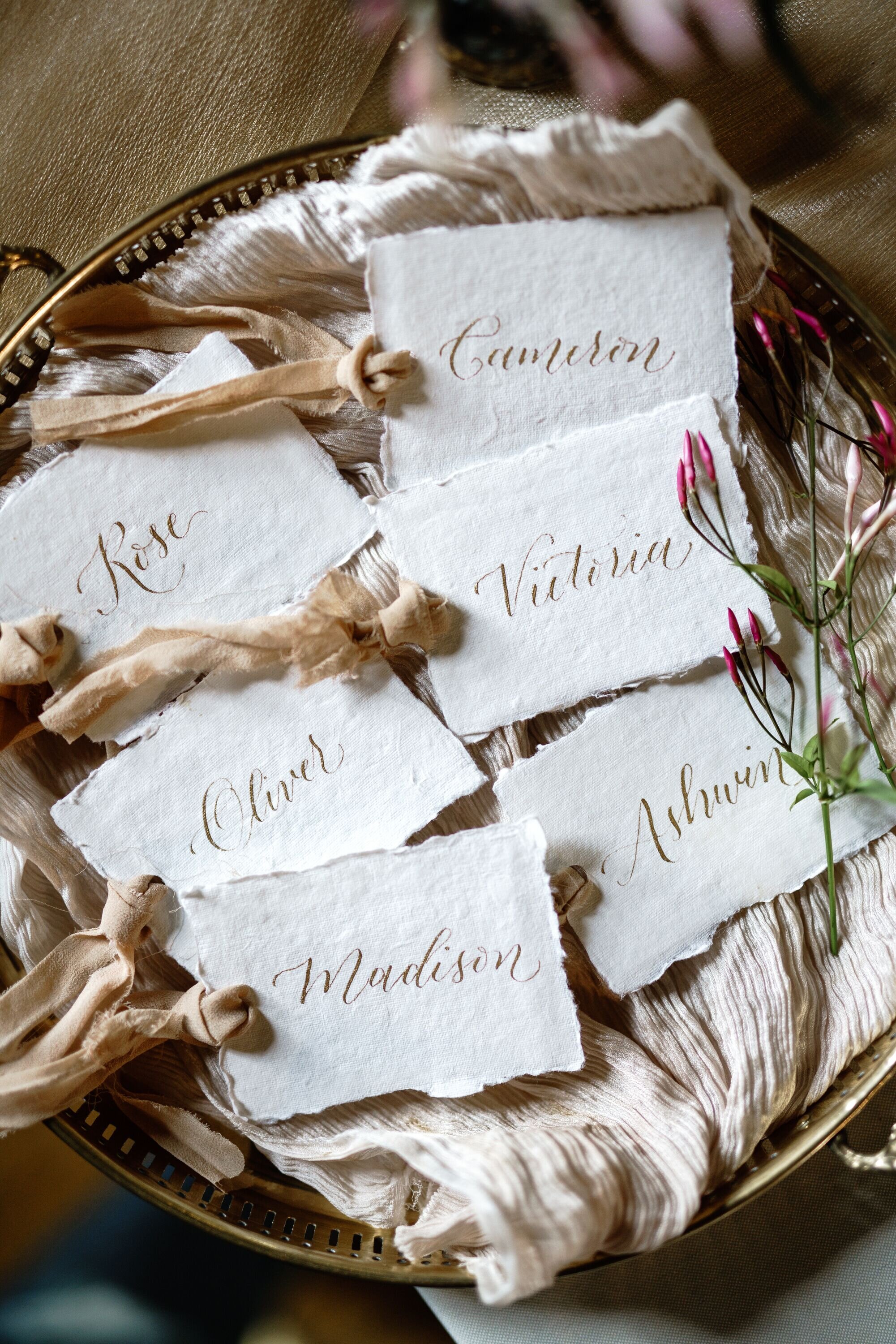 Place cards on Handmade Paper with silk ribbon