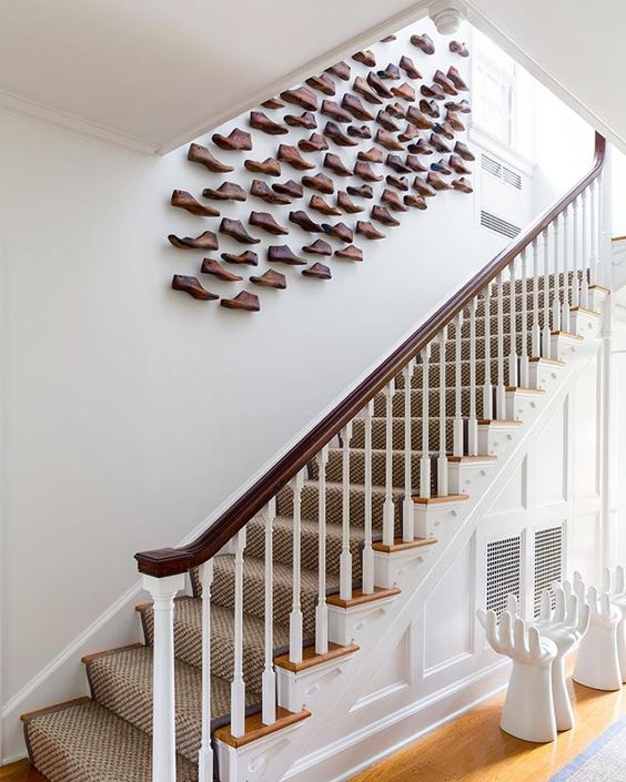  An ascending installation of vintage wood shoe forms.