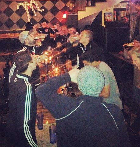 Harpo's FC teammates celebrating by taking a victory shot.