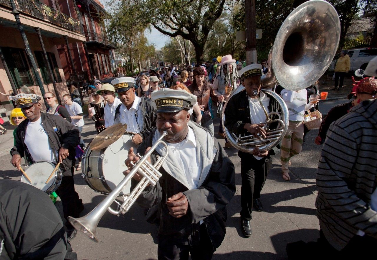 The last time we saw Samantha she was dancing down the street behind the band with a drink in her hand.