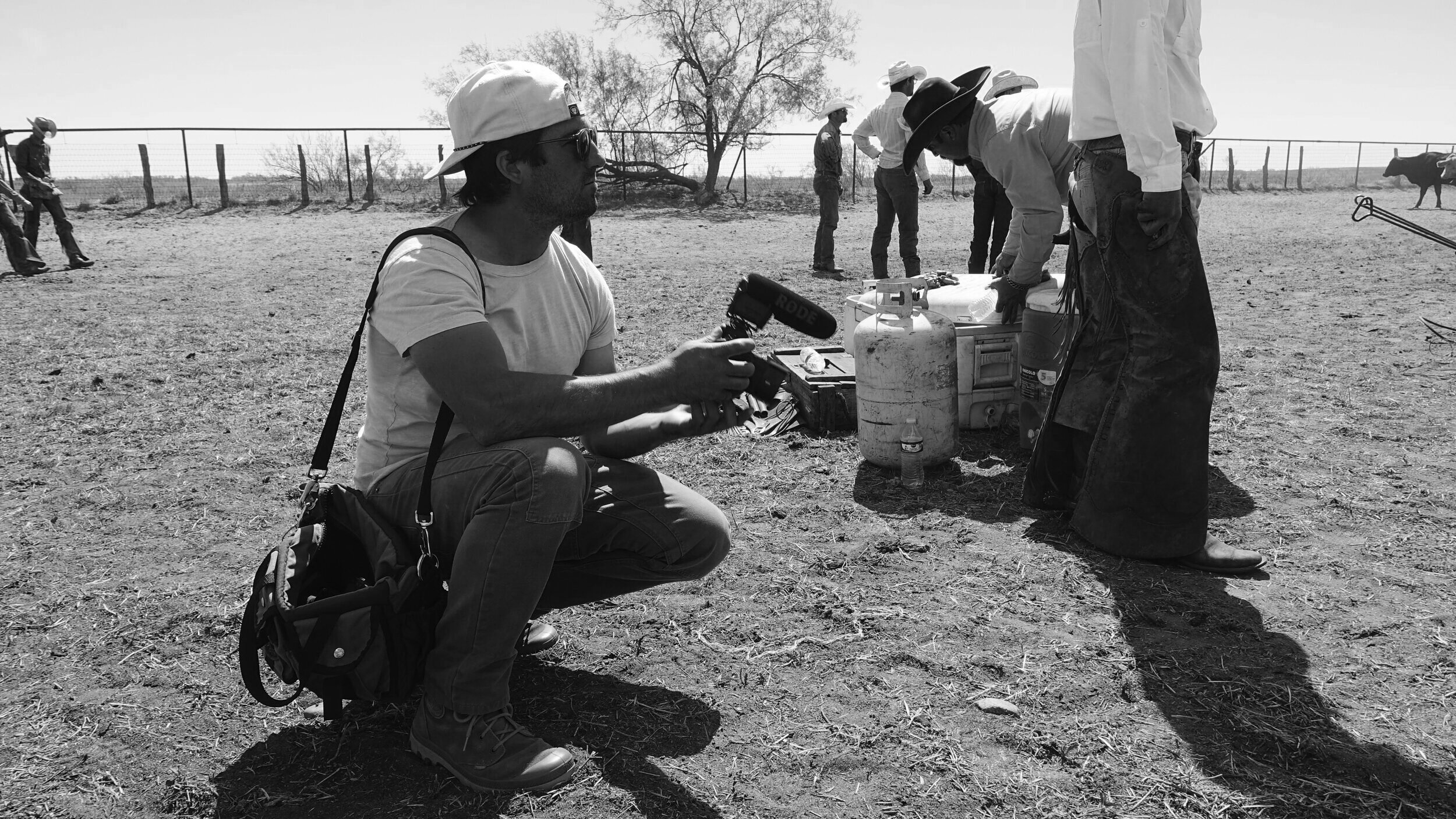  Camera operator Tito West working light and fast as cowboys brand cattle. The crew had to operate with as small a footprint as possible in order to minimize interference with the livestock and work.  