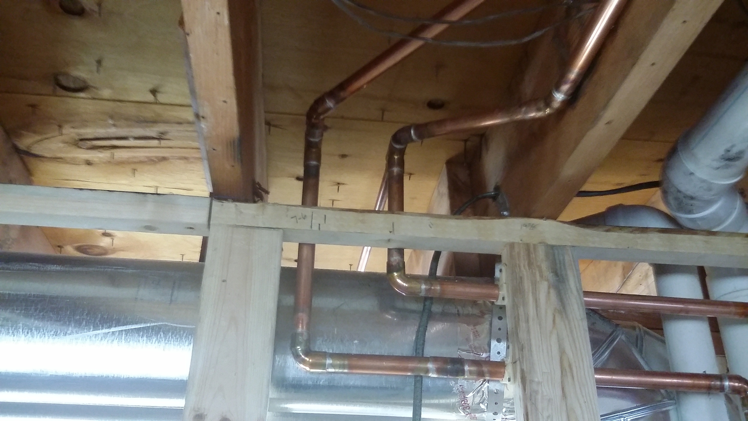 This is a great example of fitting mechanical dust supply, plumbing supply and plumbing drains into one area. &nbsp;The electrical work had not started when this picture was taken. &nbsp;Our planning paid off.