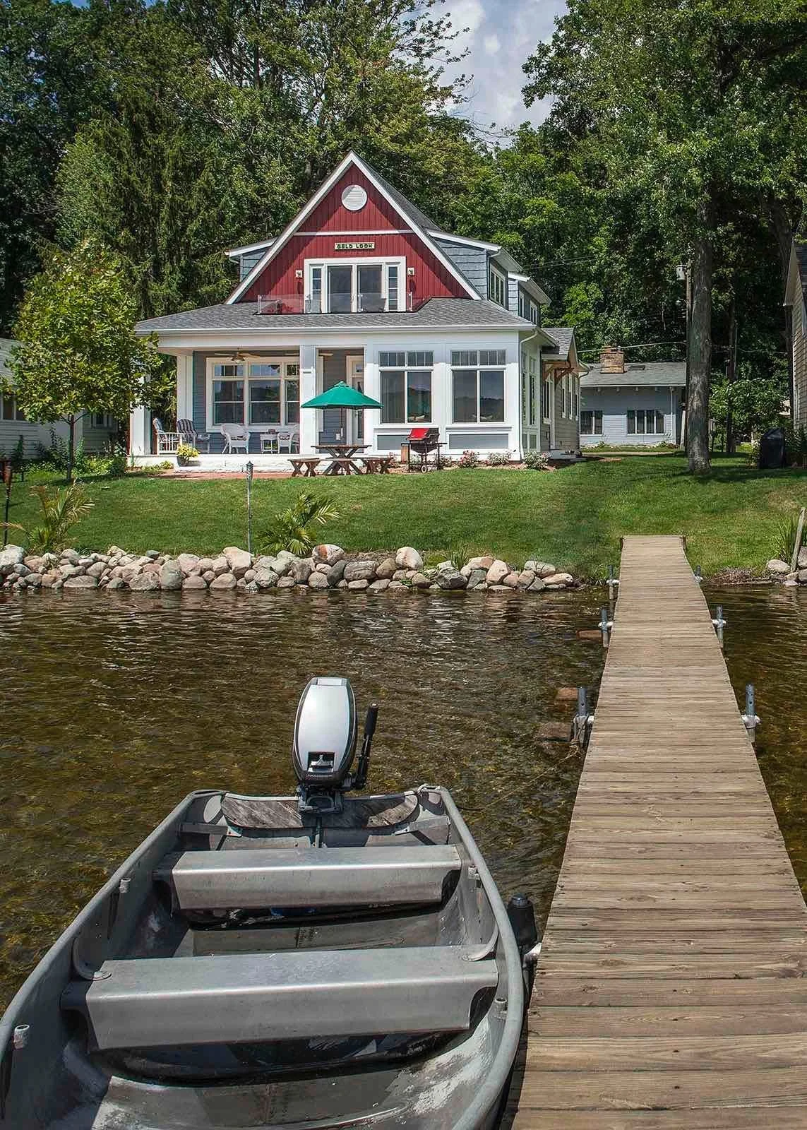 Exterior View From Lake Of Lakehouse Transformation In Custom Home by Forward Design Build.jpg