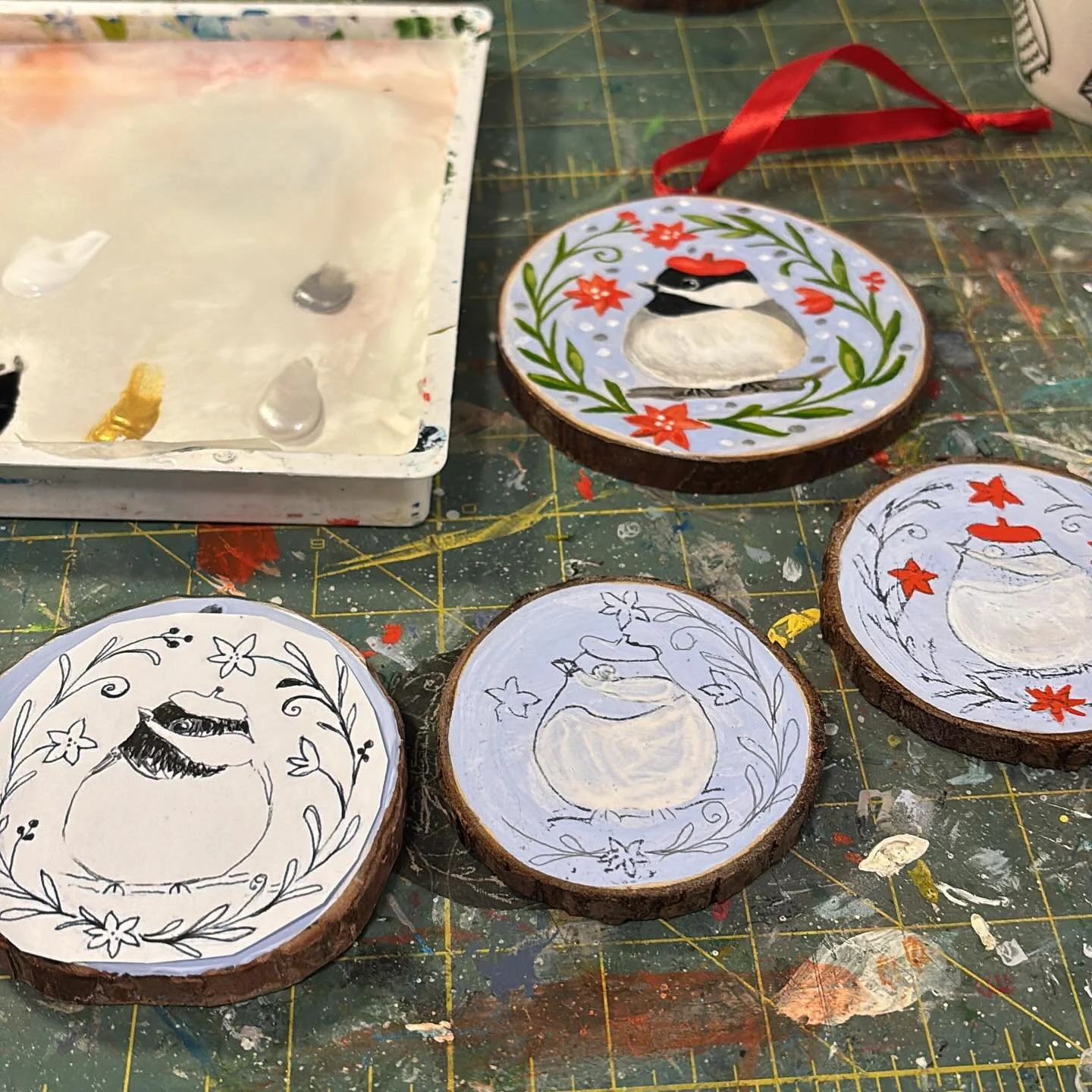 I sold out my small chickadee ornaments last Saturday so I&rsquo;m painting a few more for this weekend. @handpickedfortheholidays a three day market starting on Friday. 

#holidaymarket #woodsliceornament #acrylicgouache #handpainted #shoplocal #art