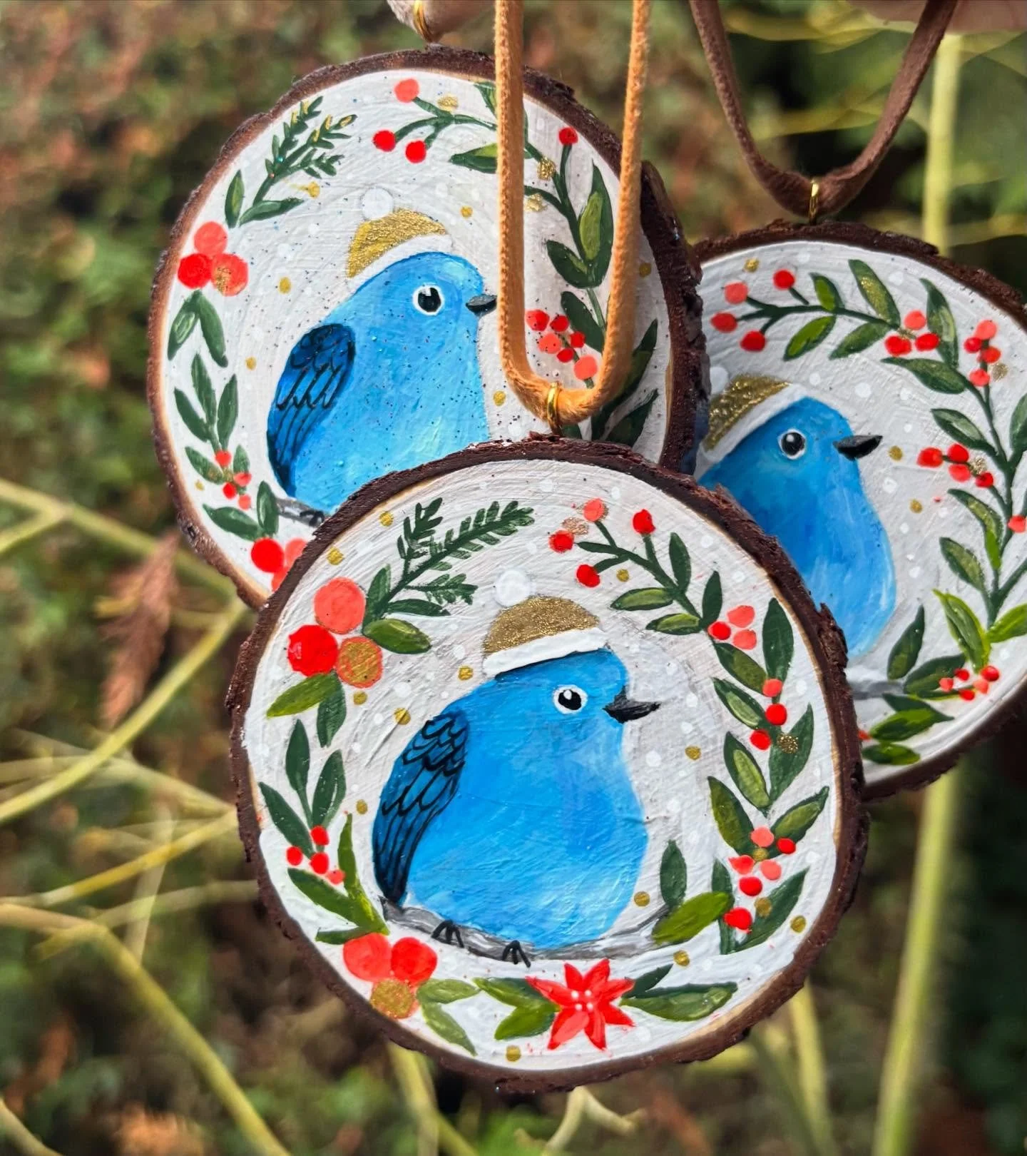 Three new bluebirds ready for market. Two day market at @westcoastgardens. #handpaintedornaments #woodsliceornament #shoplocal