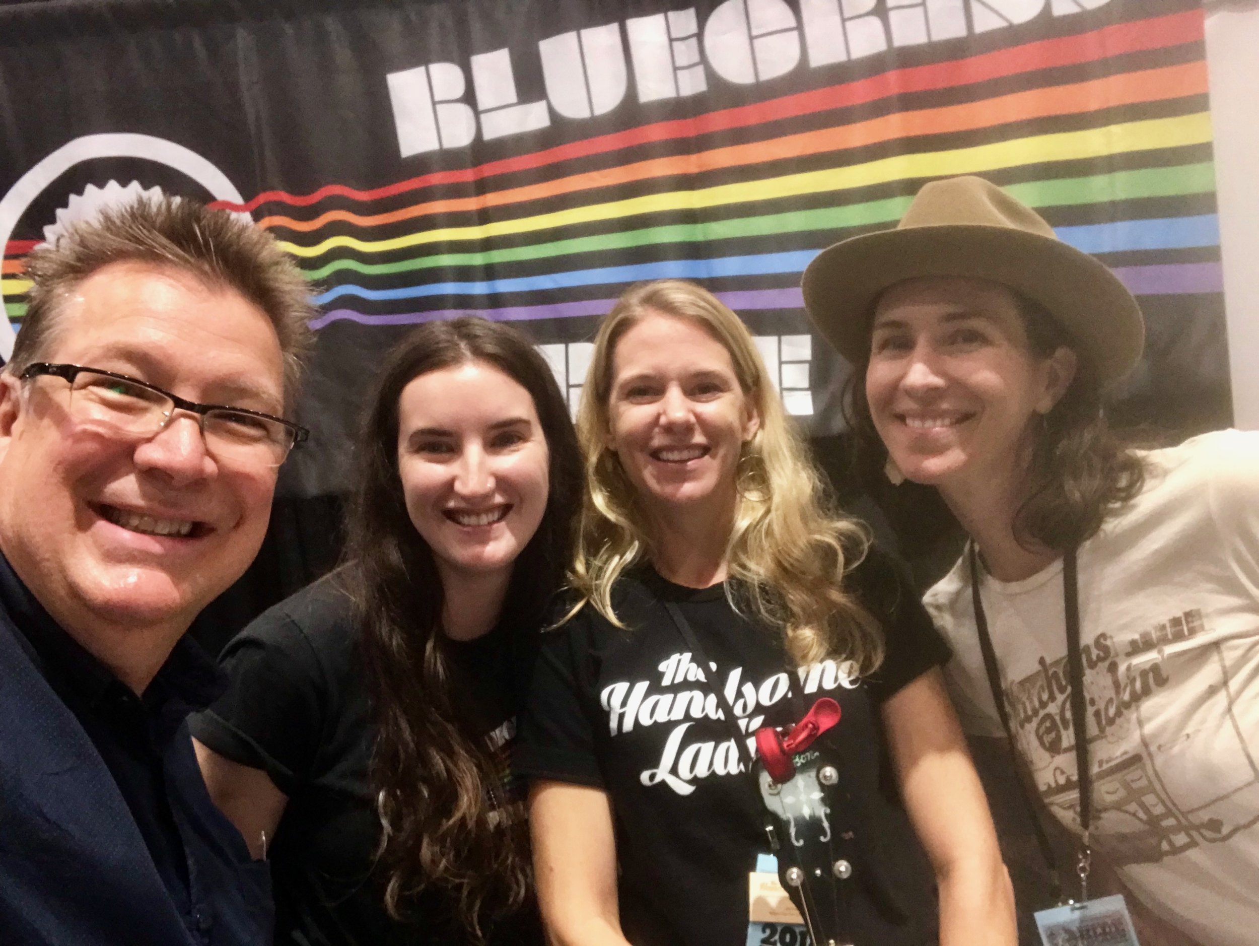 Banjo Player of the Year (and my banjo teacher) Ned Luberecki stops by our booth, Kara Kundert, me, Gina Astesana