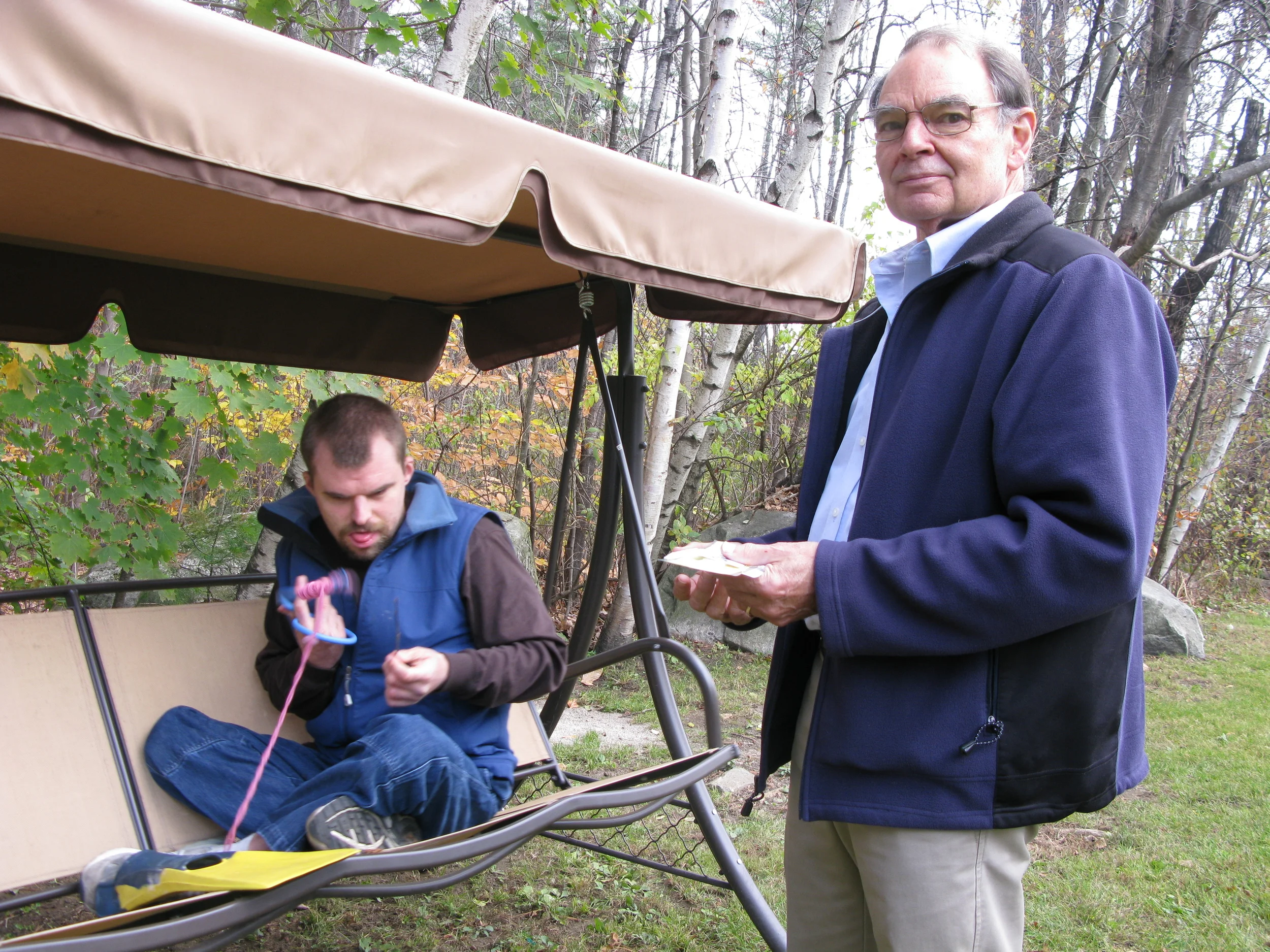   Stu Wallace with his son Ethan, in the backyard of a group home in Plymouth. Subjects of a story on Medicaid expansion by NHPR's Todd Bookman.  
