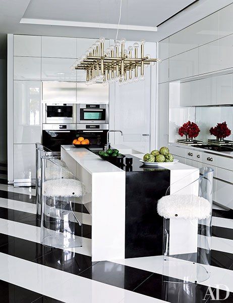 The large wide stripe on the island helps to play up the diagonal stripes on the floor. I'm also madly in love with those barstools. I would so have those in my house, minus the black strands of our dog's hair that would immediately adhere to them. At least the black would match?