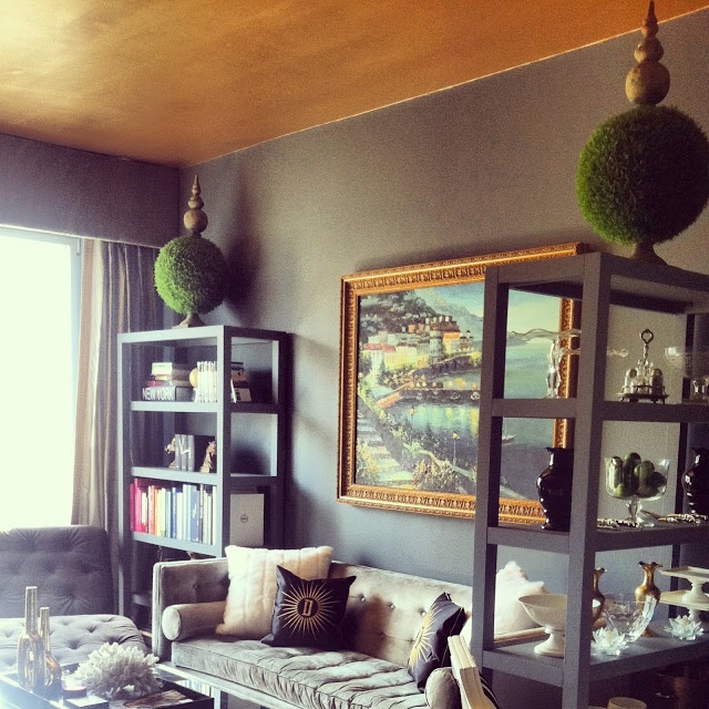 The black walls help accentuate the ceiling, making sure your eyes can't miss it. 