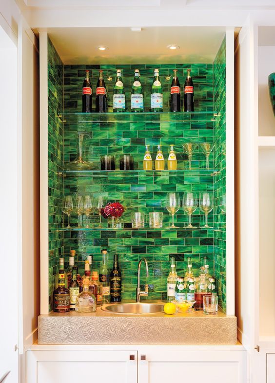 malachite tiles accent the different bottles and colors
