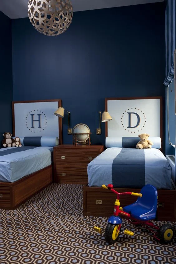 i'm not sure what i love most about this boy's room, the headboards, campaign style beds, the campaign nightstand, or the carpet!!  