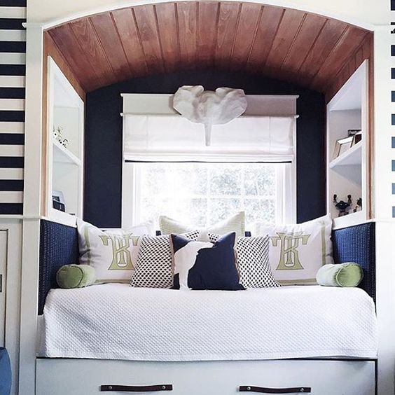 What a cozy little nook for a child's bed. just look at that arched stained ceiling via leontine linens