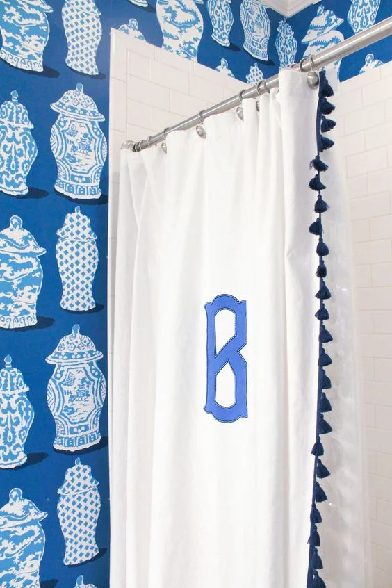 i love a monogrammed shower curtain in a child's bathroom