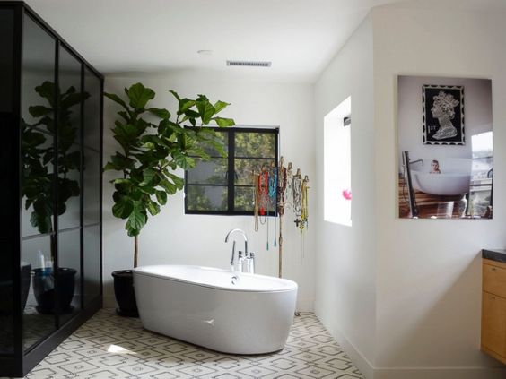 i love the photo of one of their sons in a tub. The artwork above the tub in the photo clearly inspired them for one of their pillows for walmart 