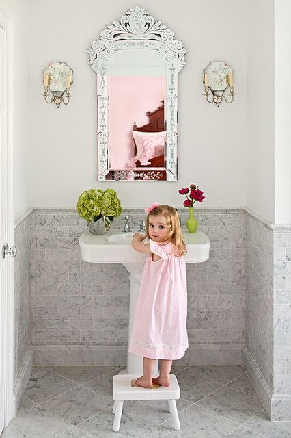 note the coordinating sconces with the mirror? Oh and that adorable little girl. that's how i would dress my little girl, but with a bow the size of texas.