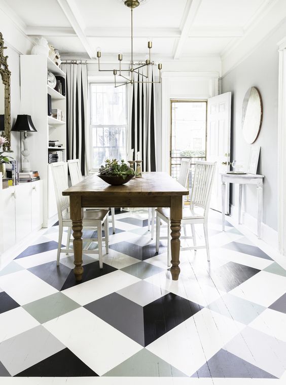What a fresh bright space. Love the drapes, light fixture and floors!