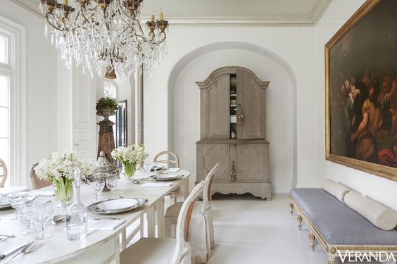 I like how when you first look at this room you get a casual feeling, yet when you stop and look at it a bit longer it also gives a feeling of formality with the chandelier, bench, and painting