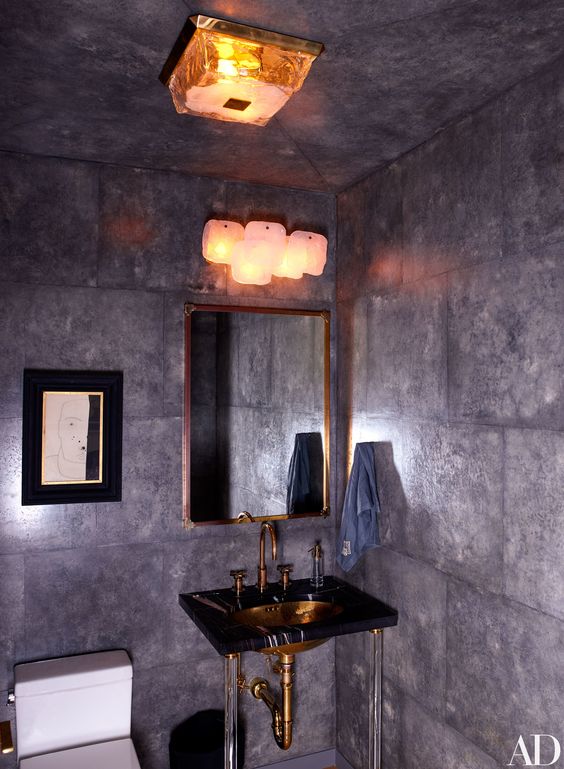 I like the unique sconce found in the powder room