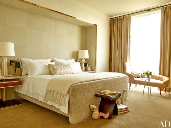 I especially love the brass detail on the master bedroom's custom bed along with the floating nightstands. Couldn't you imagine laying on that chaise and watching the hustle and bustle of the city?