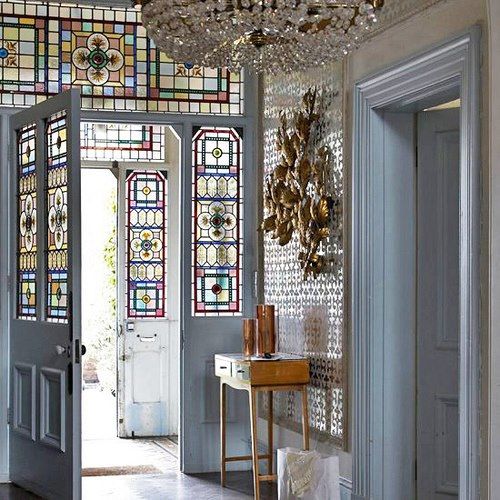 There is a lot going on in this photo, but everything is a neutral, except the stained glass windows. The golds, crystals, and silver highlight the art of the glass.
