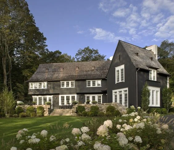 Reminicent of an old english home, but with some modern aesthetics. if you think this is beautiful, you need to see the rest of the exterior and interior of the home. The interior was designed by Alexa Hampton . 