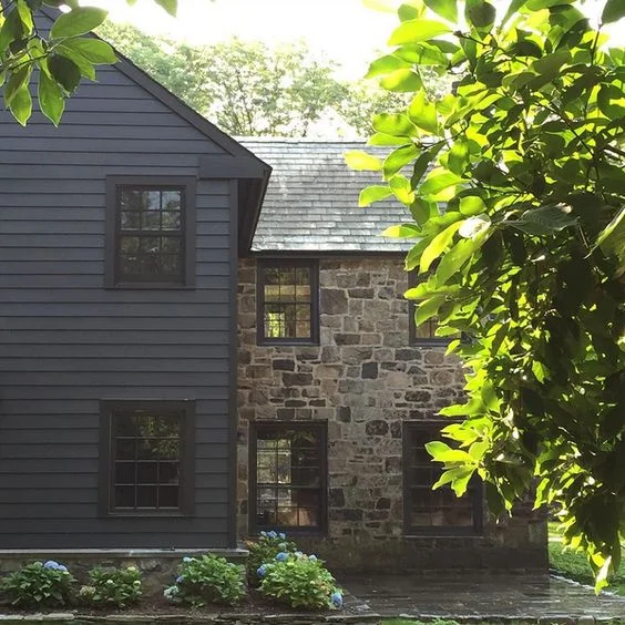 This stone gives me the feel of an old english cottage combined with the worn wood shingles. 