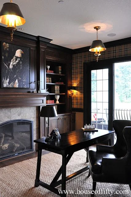 An office is the perfect setting for a tartan plaid. This office is a masculine classic with wood tones, plaid and leather. 
