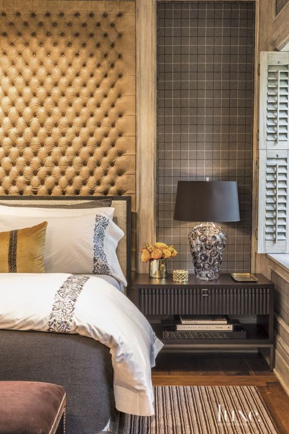 What a great stain color on the bed frame, mouldings around the windows, shutters, and baseboards. Via Luxe