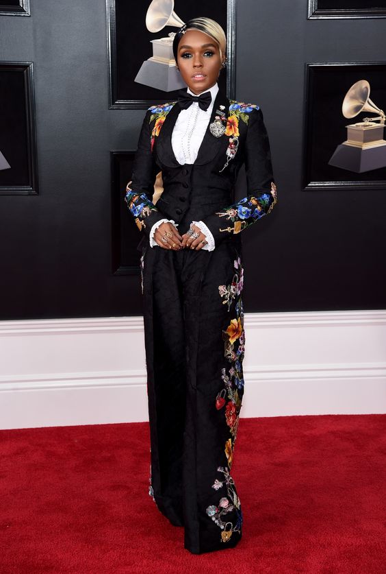 Janelle Monae wearing dolce & Gabbana. This look stopped me in my tracks. it's a practice in restraint when it comes to both fashion and design. How much can you push it without it being too much. there's a definite fine line for sure. This is a perfect example. sure there is a lot going on in this outfit. but if say the white ruffle sleeve wasn't there, I think you would feel the black needed to be broken up a bit. She has a lot of rings but they are all for the most part simple, not blingy which had they been, would have been too much. 