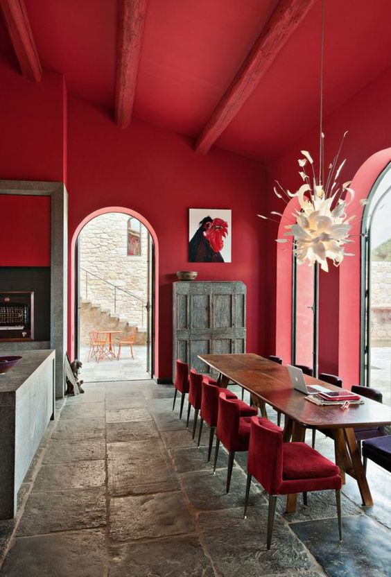 What a great COMBINATION; rustic, contemporary, and bold. I'll tell you, it's those large doors, that make this room work. It feels breezy and light, while being covered top to bottom in cherry red. 