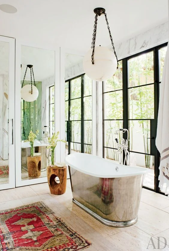 Fashion Designer Jenni Kayne's 1980s home got quite the transformation with this Waterworks tub . Via Architectural Digest 
