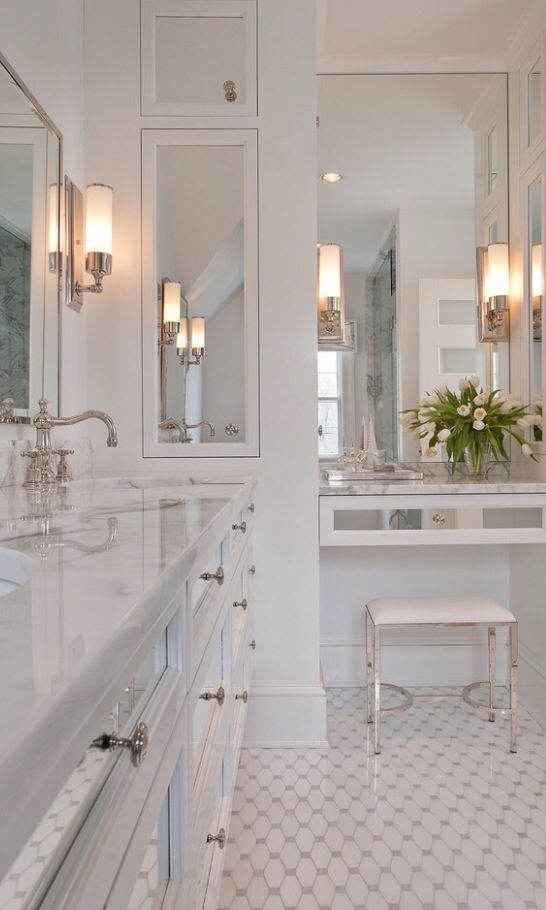 Mirrors are such a great way to bounce light and make a room feel bigger. add those to an all white room and you'll feel like you're in a 1,000 sq. ft. bathroom. 