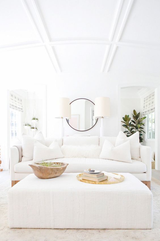This room is very california. It's a true, all white room but with the small touches of wood it warms the space up. It also doesn't hurt when you have a coffered arched ceiling either. via jenni kayne 