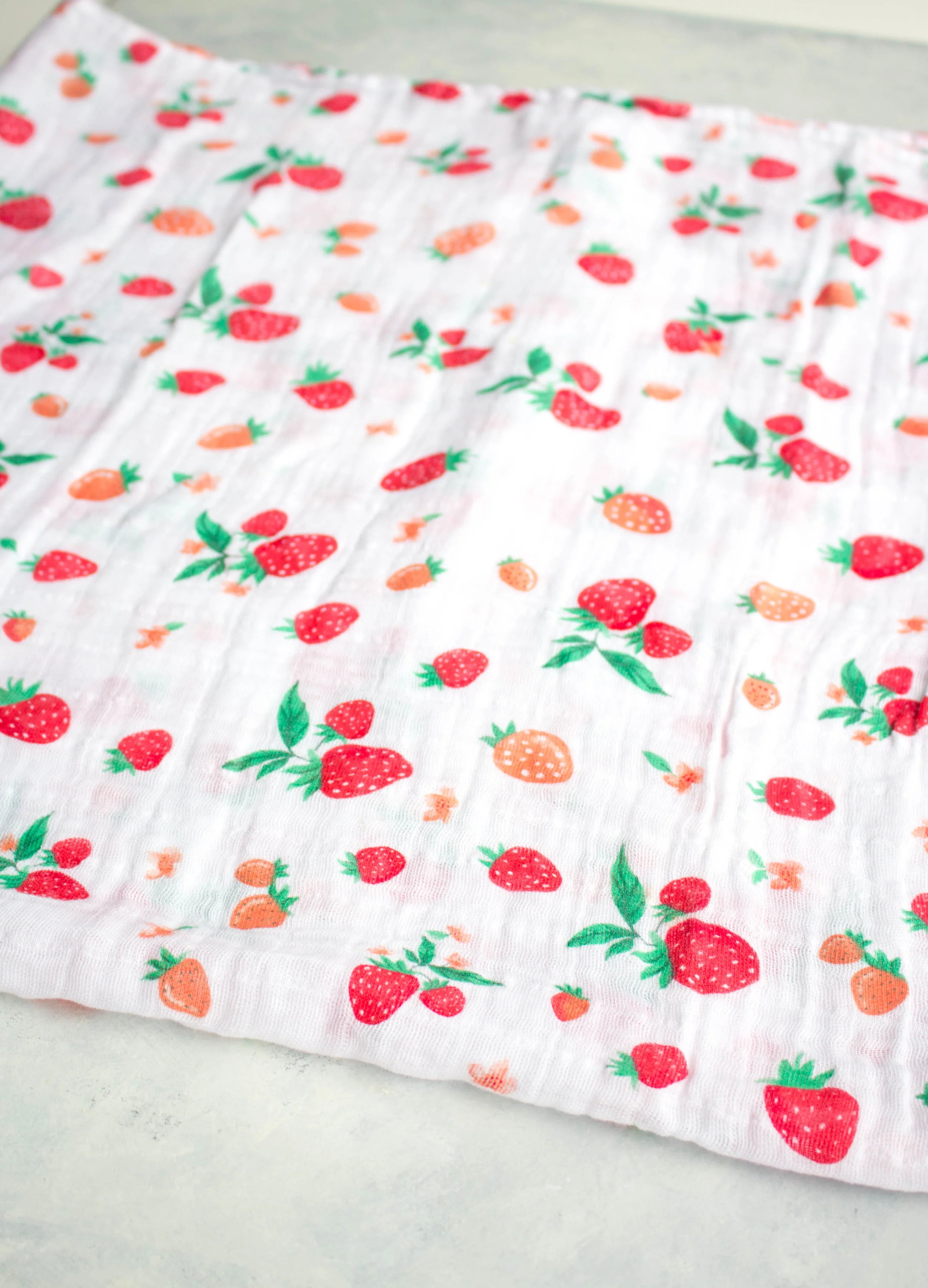 Lay your swaddle blanket down flat. I folded this into a square, as they are rather large!