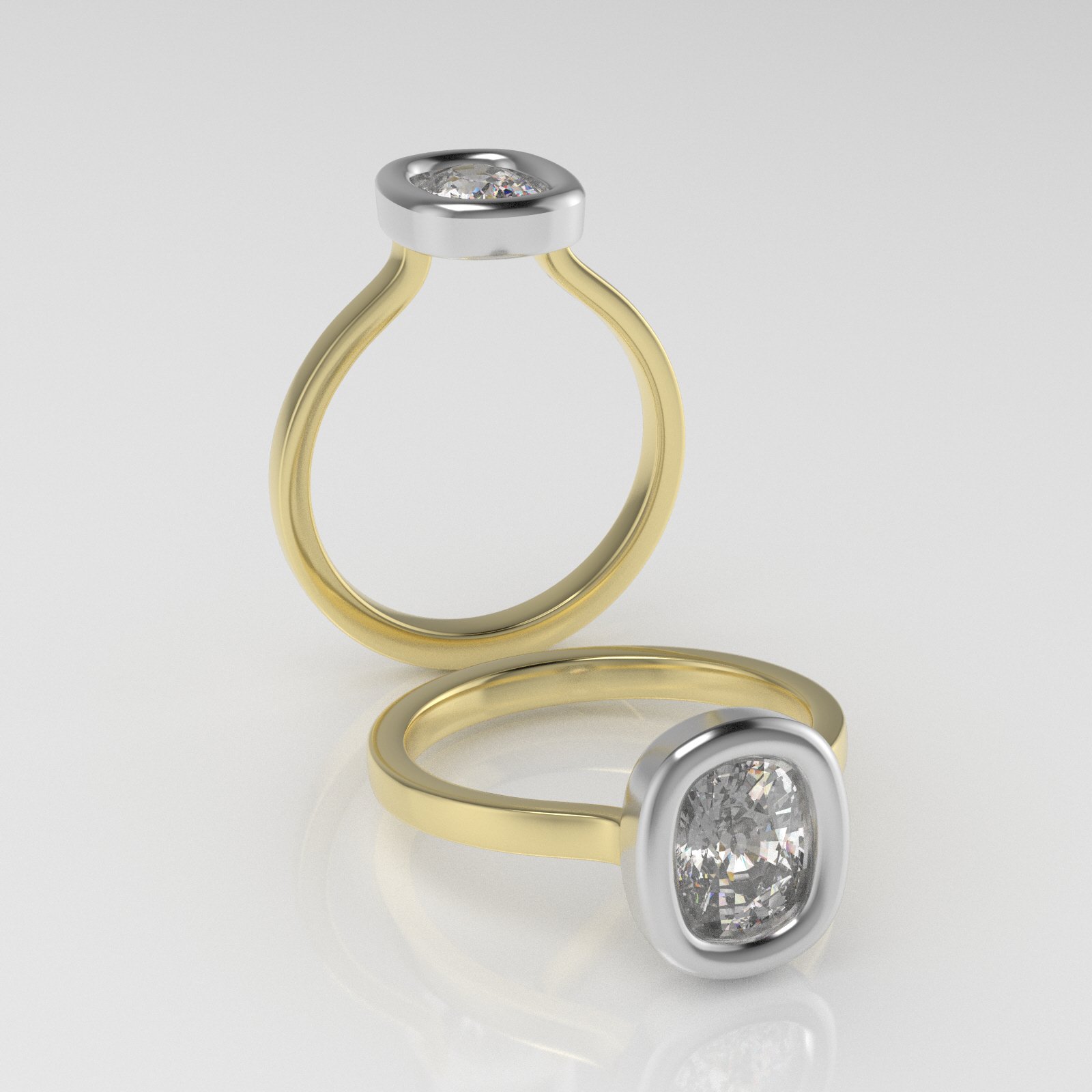 A gold ring and a silver ring, both with large diamond settings, displayed on a white surface.
