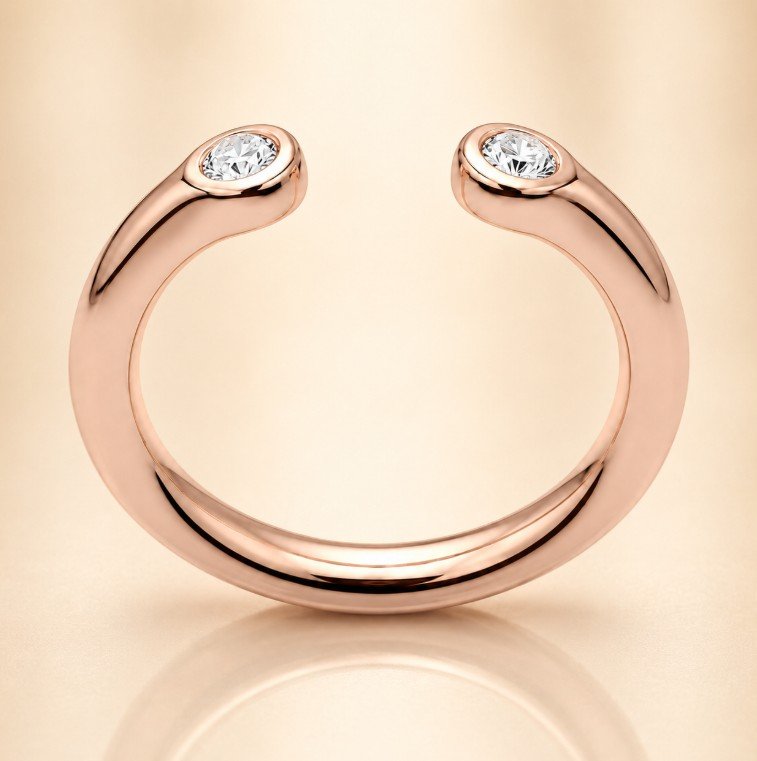 Rose-gold open cuff-style ring with two round diamonds at each end, set against a beige background.