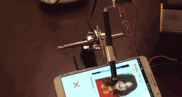 A Tinder robot demonstrating the swiping to accept interaction