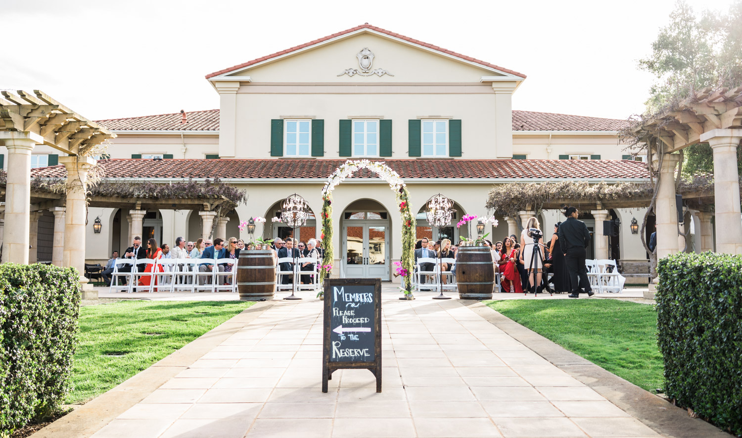 The spring wedding ceremony held outside in the open courtyard. 