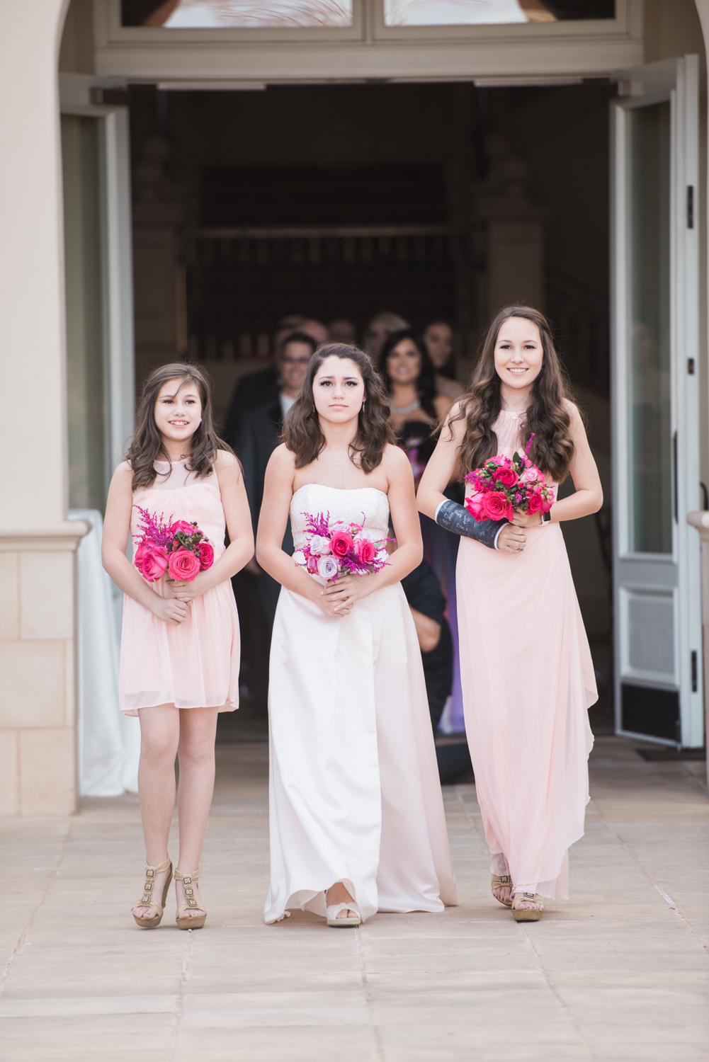 Maid of honour walking down the aisle.