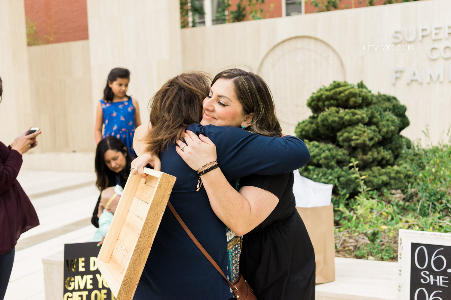 Moments of hugging & crying right after the ceremony outside the courthouse.